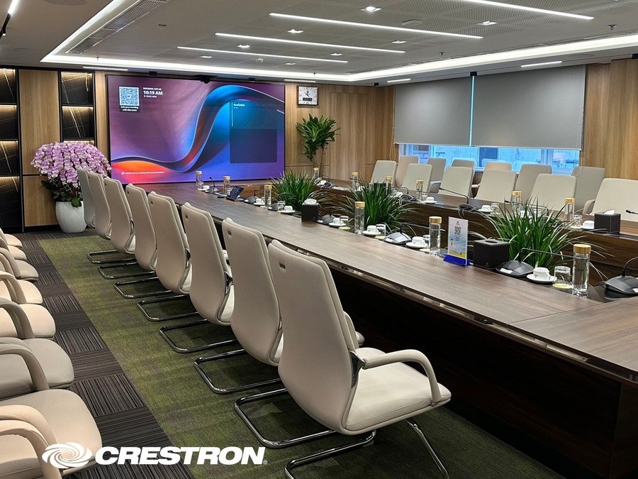 A modern conference room using Crestron DM-NVX system to share content.